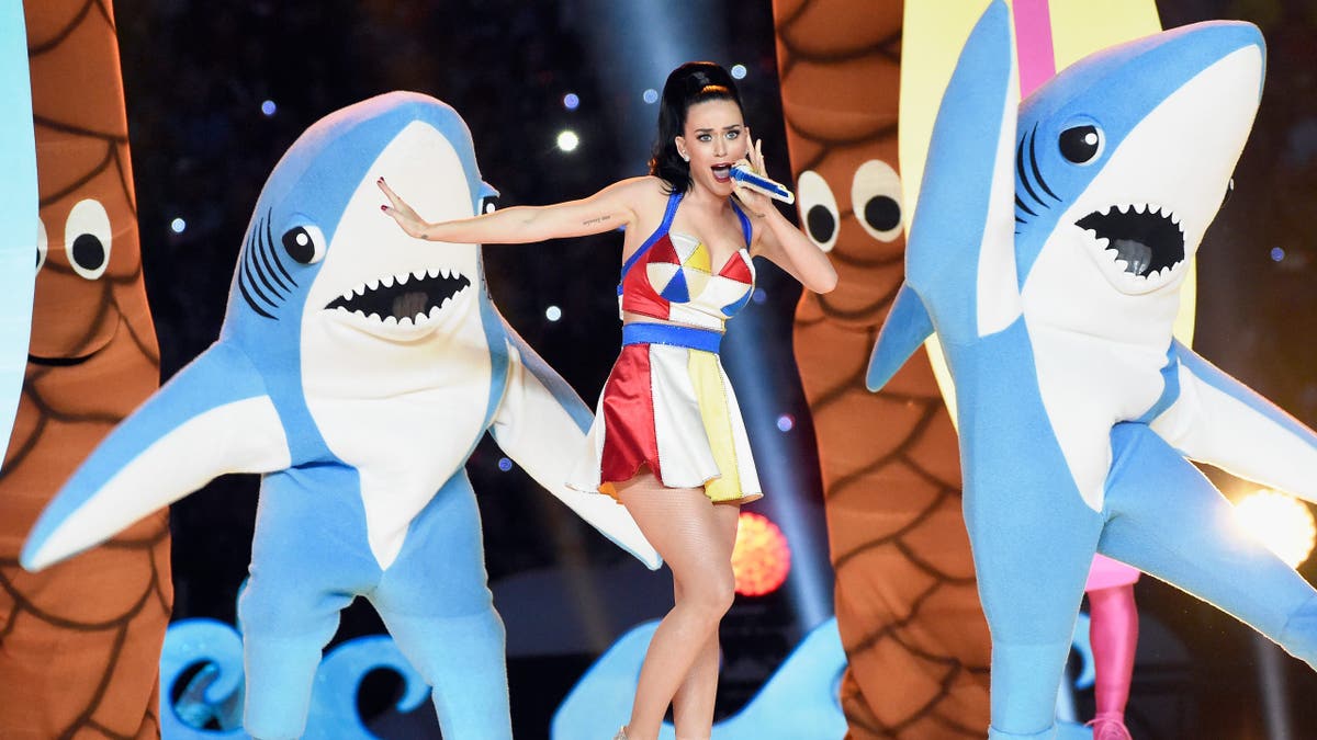 Katy Perry performs with shark dancers on stage during Super Bowl Halftime show. 