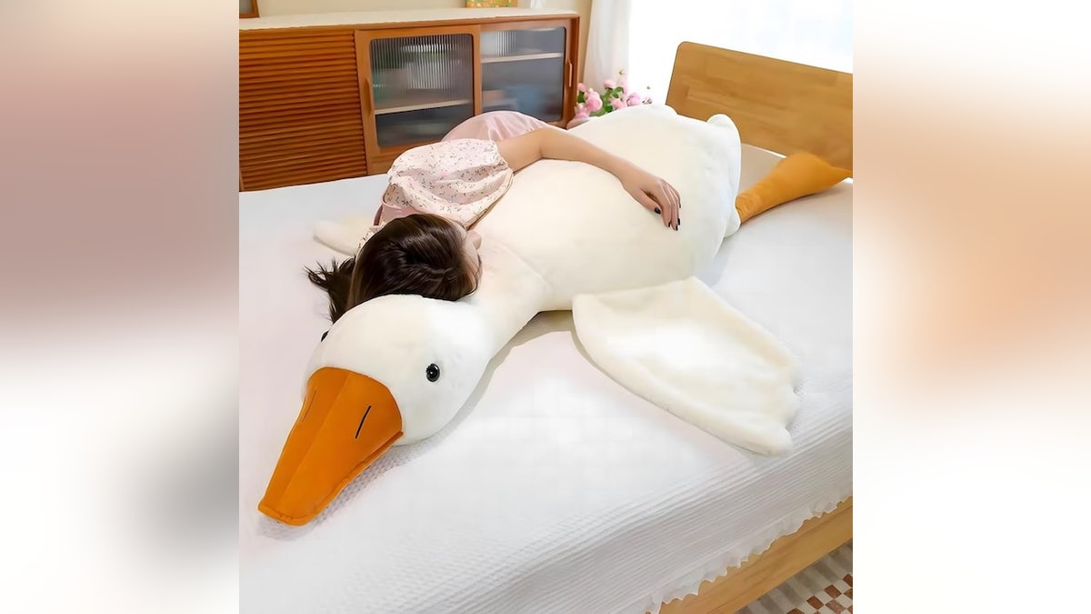 Snuggle up with this plush that doubles as a body pillow.