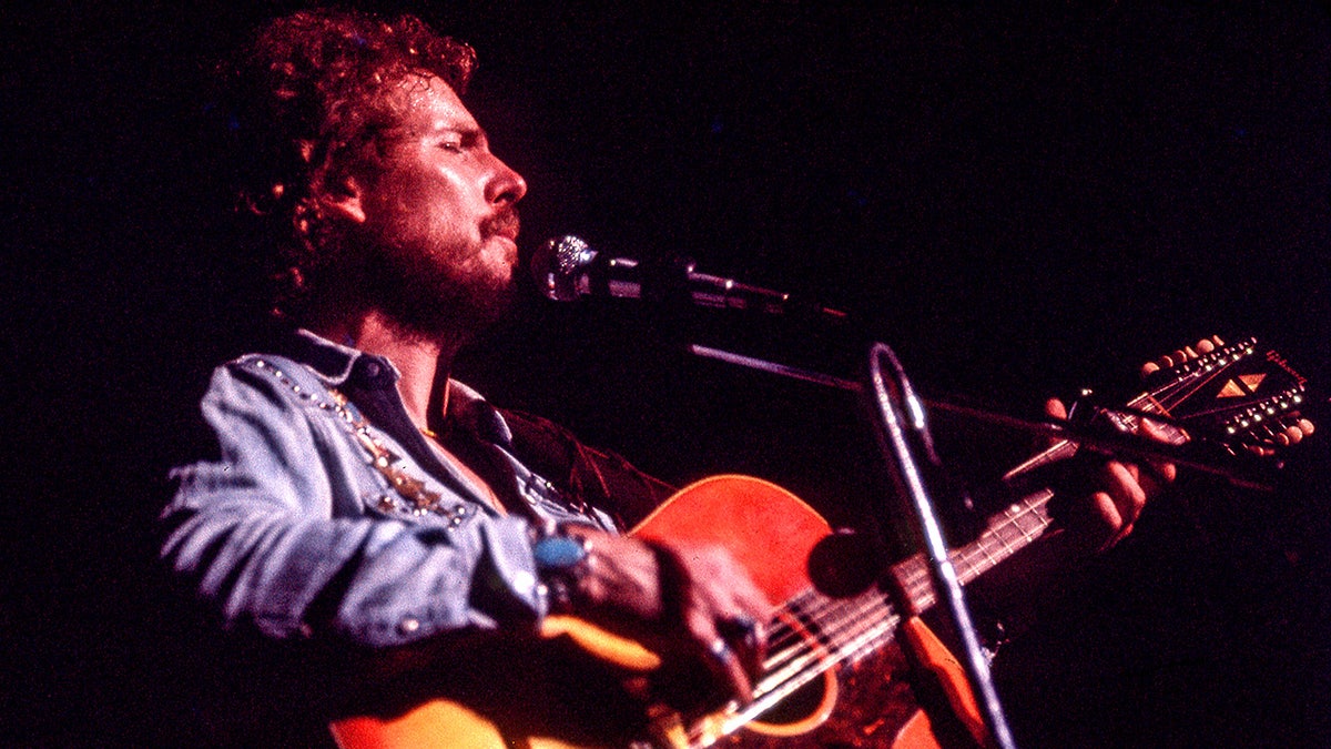 Singer-songwriter Gordon Lightfoot performs on stage at Symphony Hall in Boston in 1974.