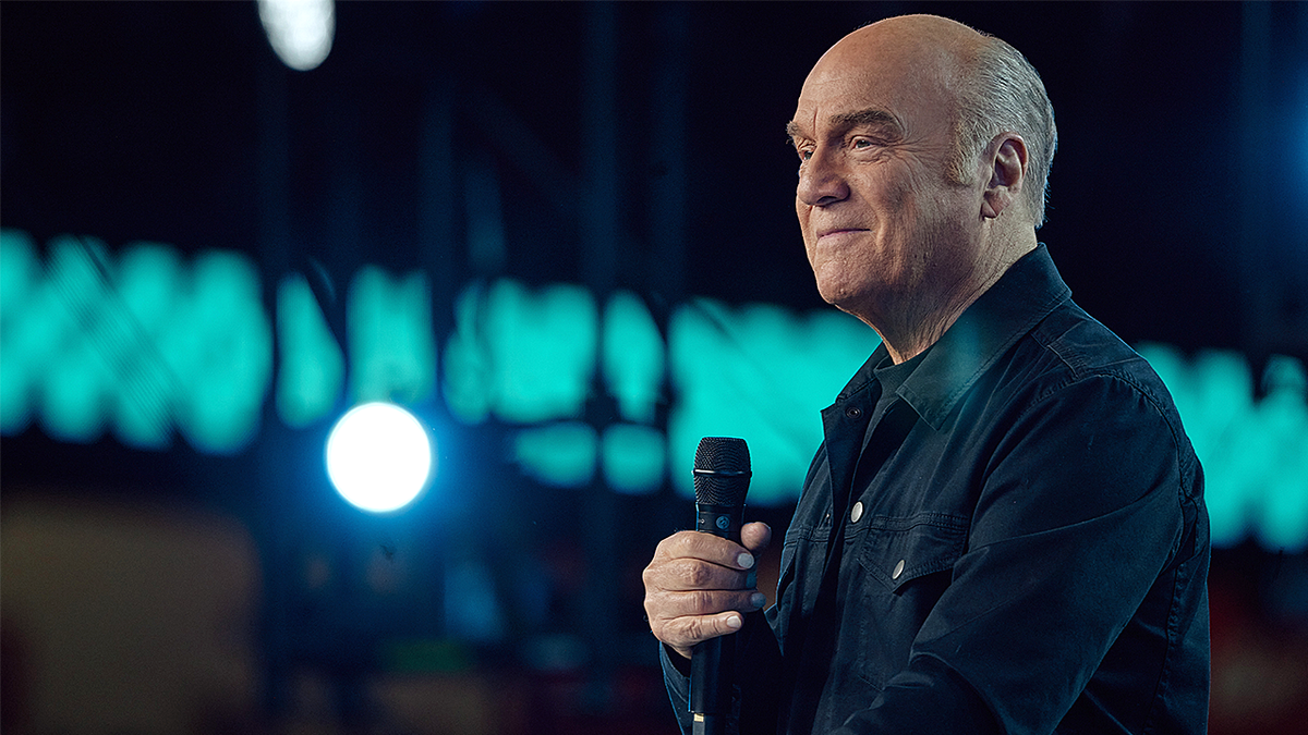 Pastor Greg Laurie with mic in hand
