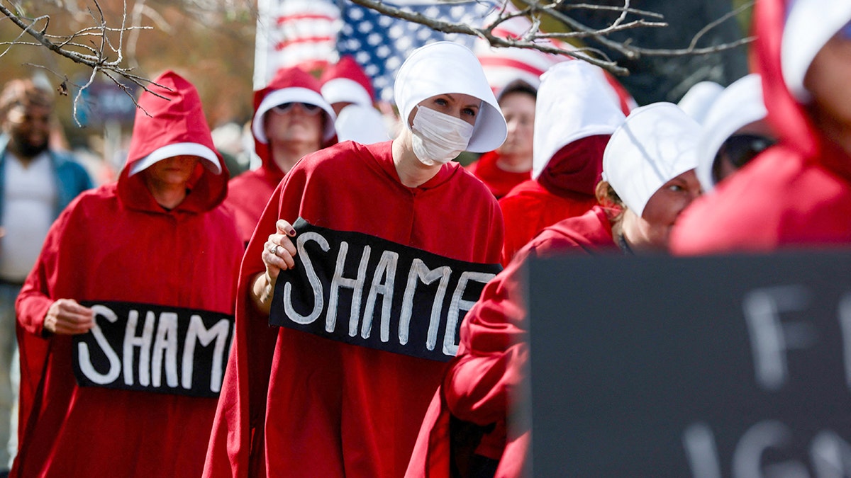Handmaidens from "The Handmaid's Tale" at a protest