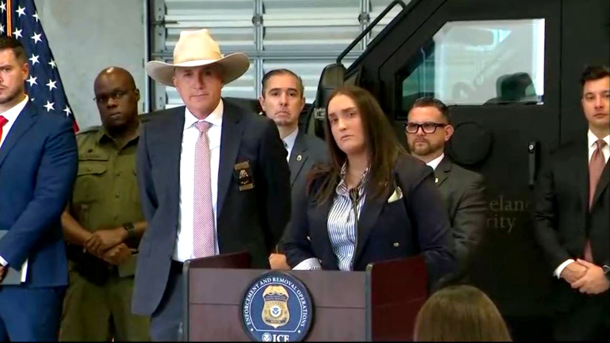 state and federal officials holding a press conference