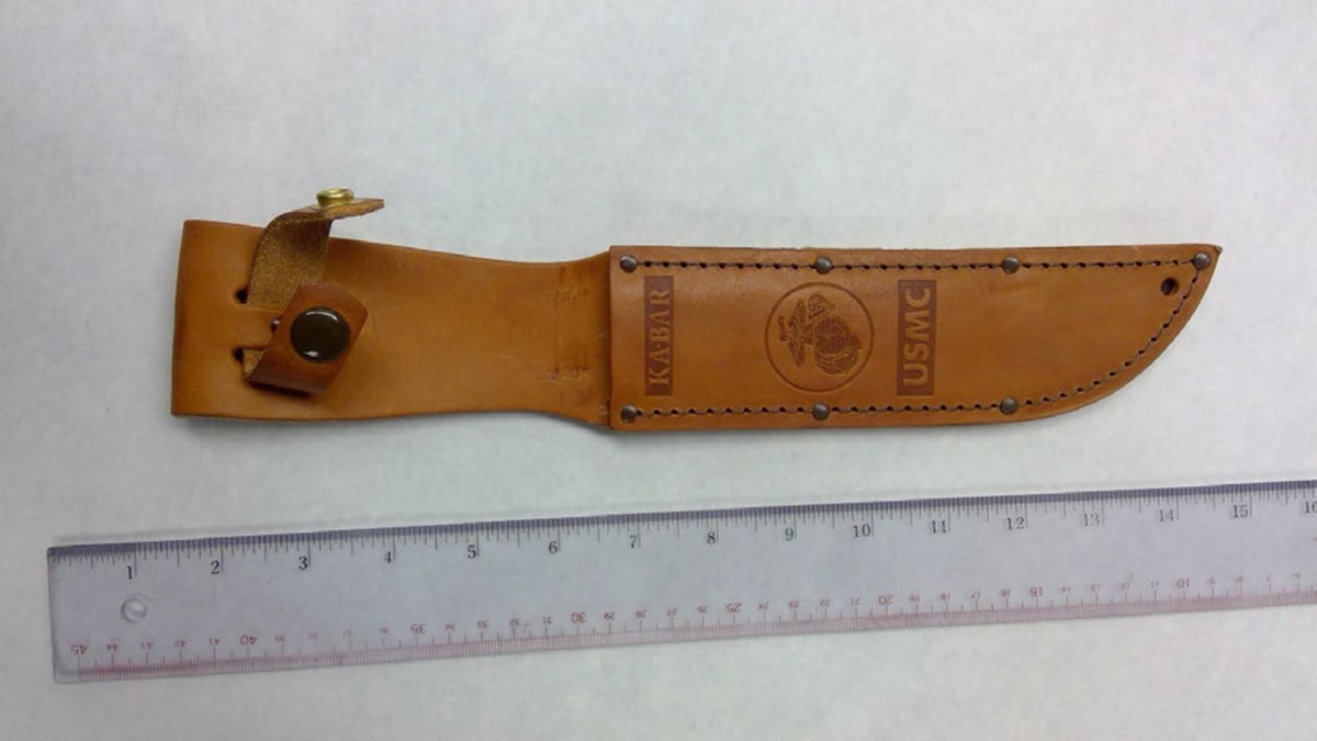 KA-BAR weapon  sheath displayed connected  a aboveground  arsenic  grounds  successful  a execution  case