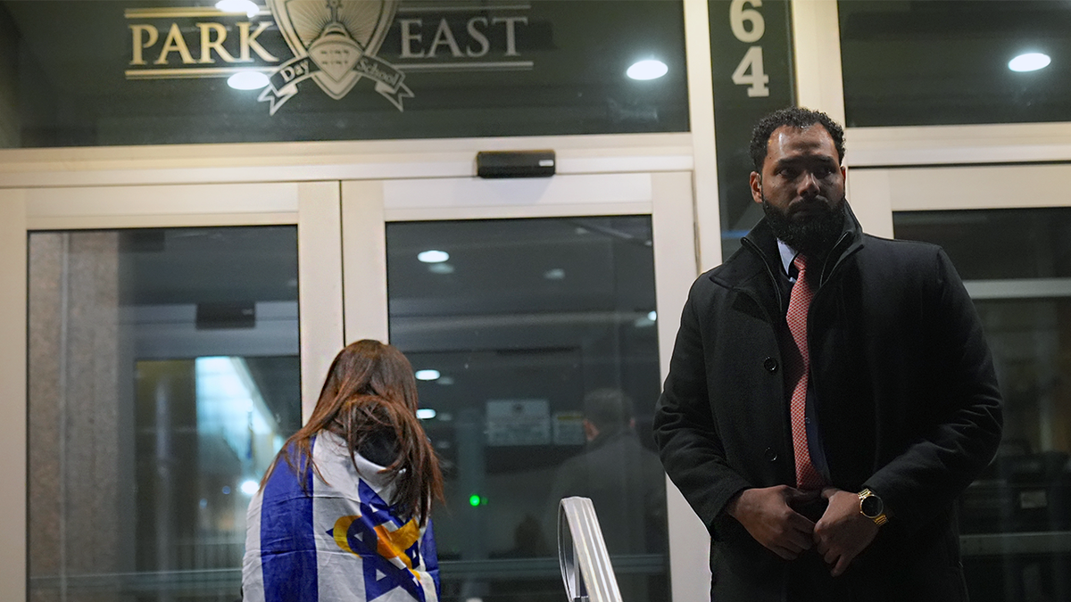 A woman wearing an Israeli flag enters the Park East Synagogue in Manhattan
