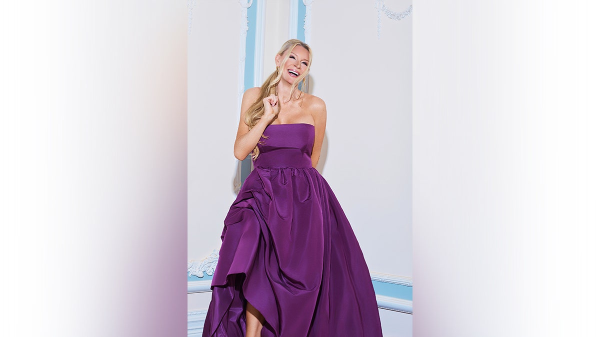 Jackie Siegel wearing a strapless purple dress