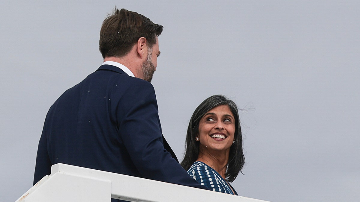 Jd Vance and Usha Vance looking at each other