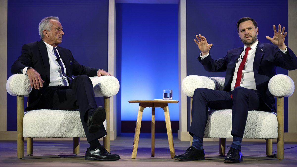 U.S. Vice President JD Vance (R) and Secretary of Health and Human Services Robert F. Kennedy Jr. (L) participate in a discussion during The Official MAHA Summit at Waldorf Astoria Hotel on November 12, 2025 in Washington, DC. Top Trump administration officials, executives and influencers gathered to discuss the 