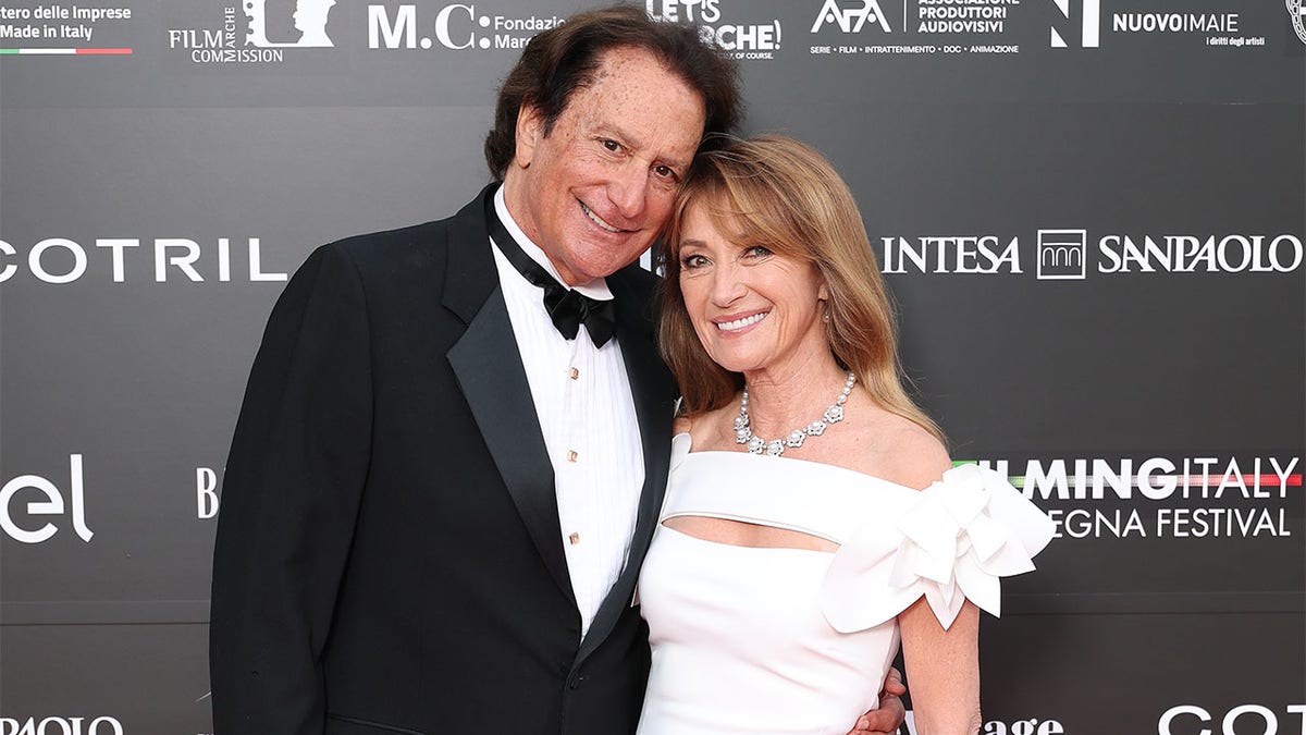 John Zambetti and Jane Seymour smiling on the red carpet