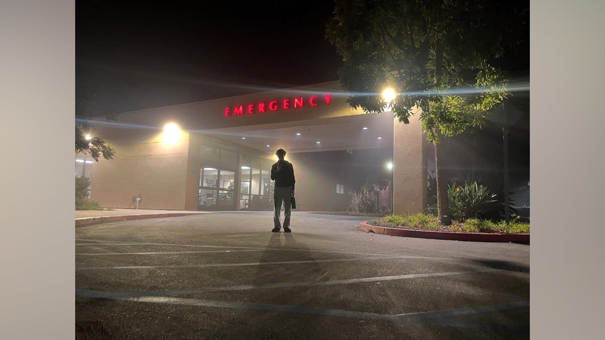 A person stands outside a hospital emergency room at night in a photo Julie Bowen shared during a Thanksgiving 2024 ER visit.