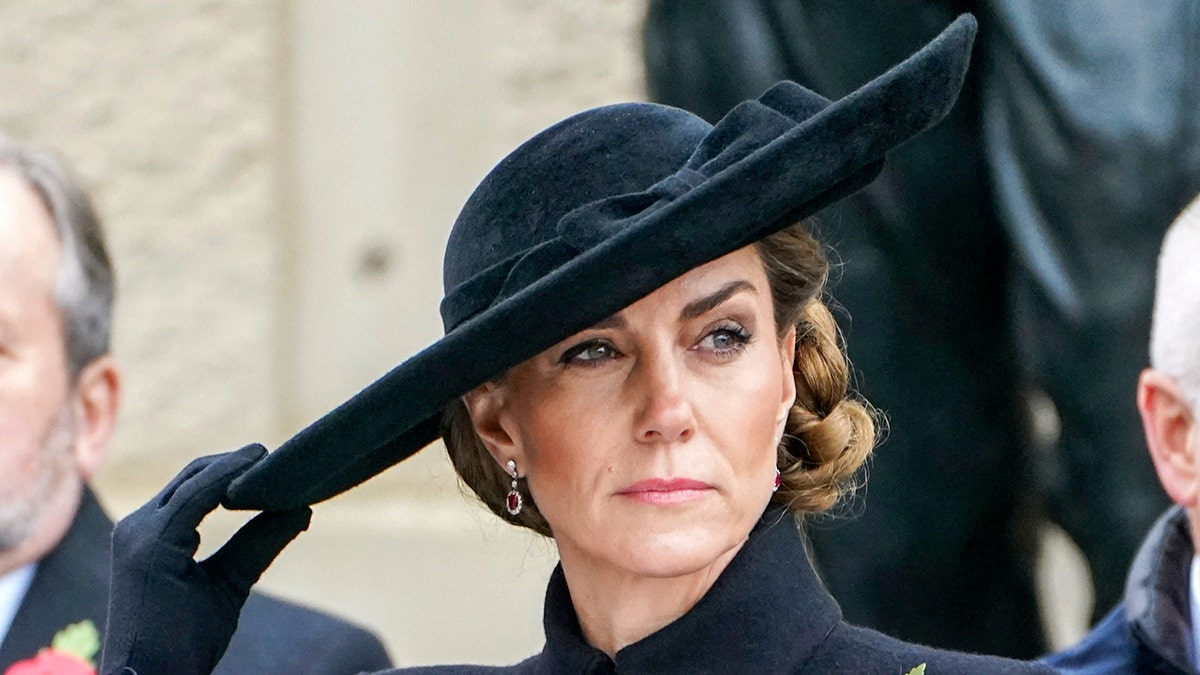 Kate Middleton wearing a black, wide-brimmed hat for Armistice Day