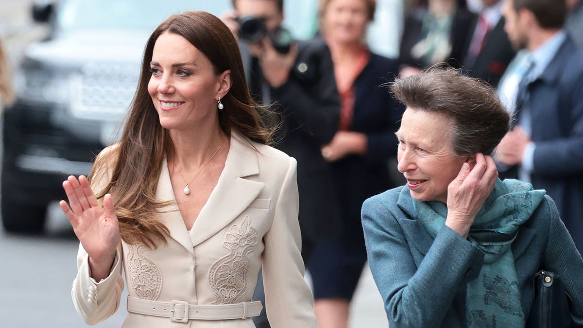 Kate Middleton and Princess Anne walking side-by-side in a crowd.