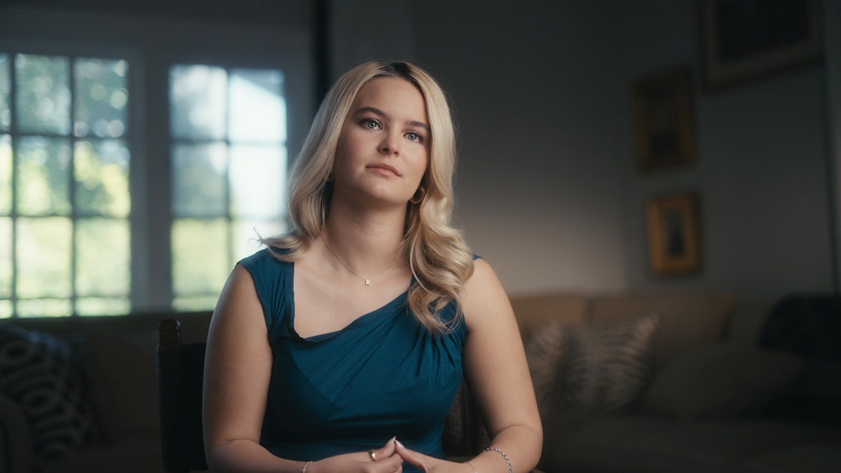 Kaya Callahan wearing a blue dress speaking out in My Nightmare Stalker.