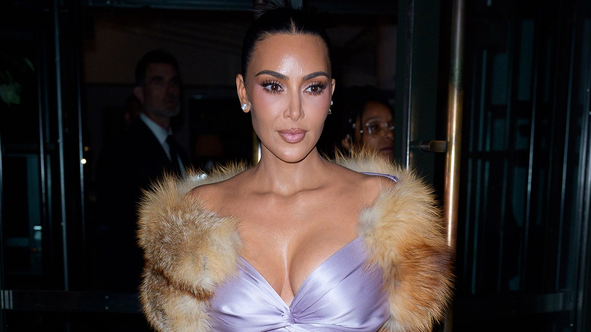 Kim Kardashian in a purple top while out in New York in October 2025.
