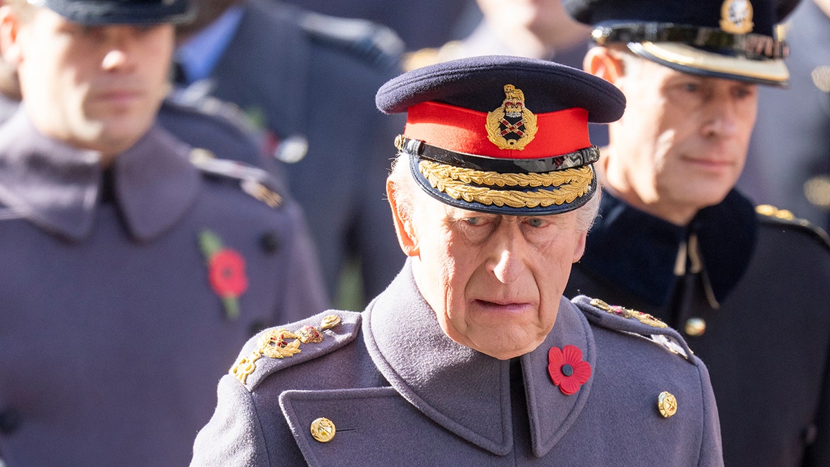 King Charles looking somber in uniform on Remembrance Day.