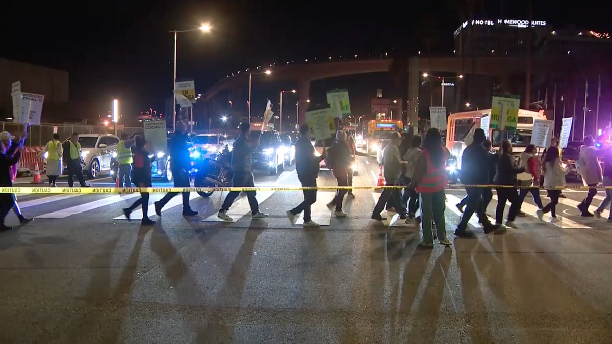 Protesters march as cars stopped near LAX