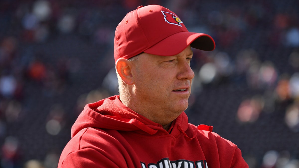 Jeff Brohm looks connected earlier a game