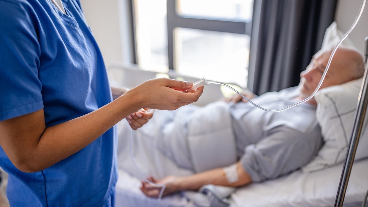 Man getting IV in hospital