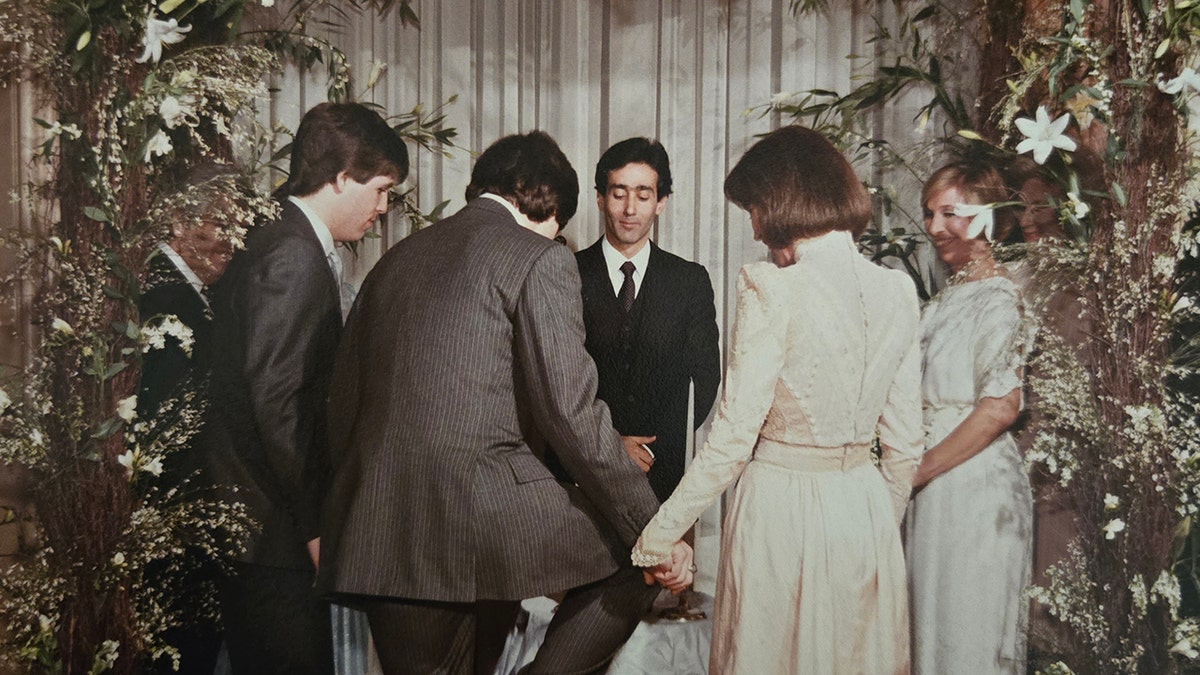 Dr. S Robert Levine about to stomp on glass during his wedding to Mary Tyler Moore.