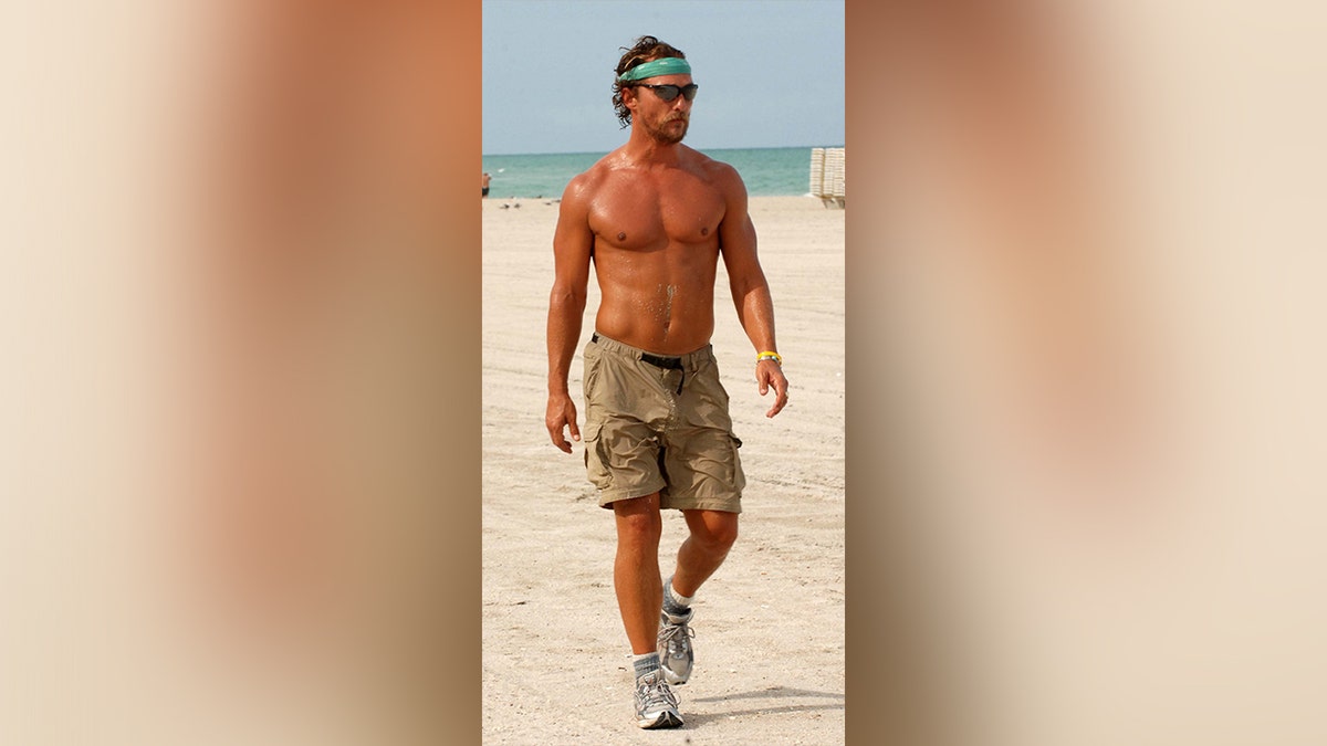 A shirtless Matthew McConaughey on the beach in August 2006