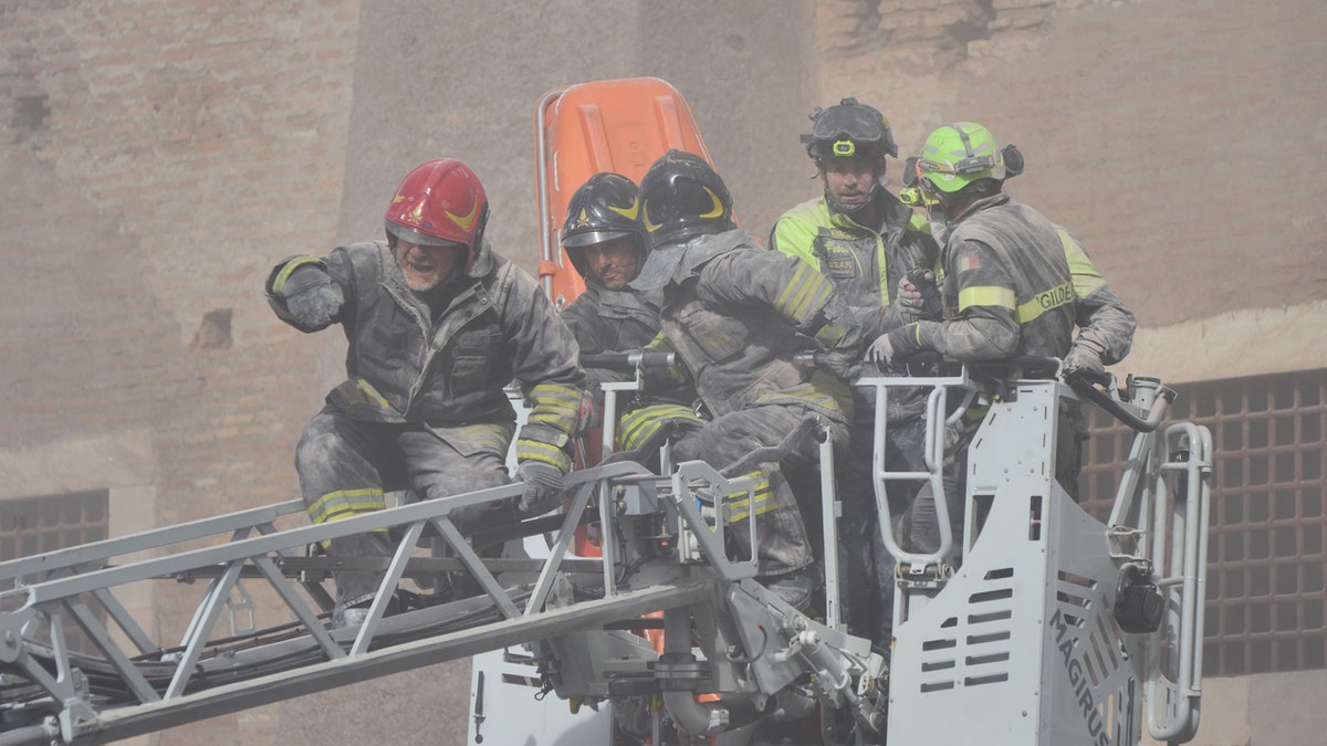 Worker dies after 11-hour rescue from collapsed medieval tower in Rome 2 Three workers were rescued without injury after the collapse, with another person hospitalized and in critical condition. No firefighters were hurt during the rescue on Monday.