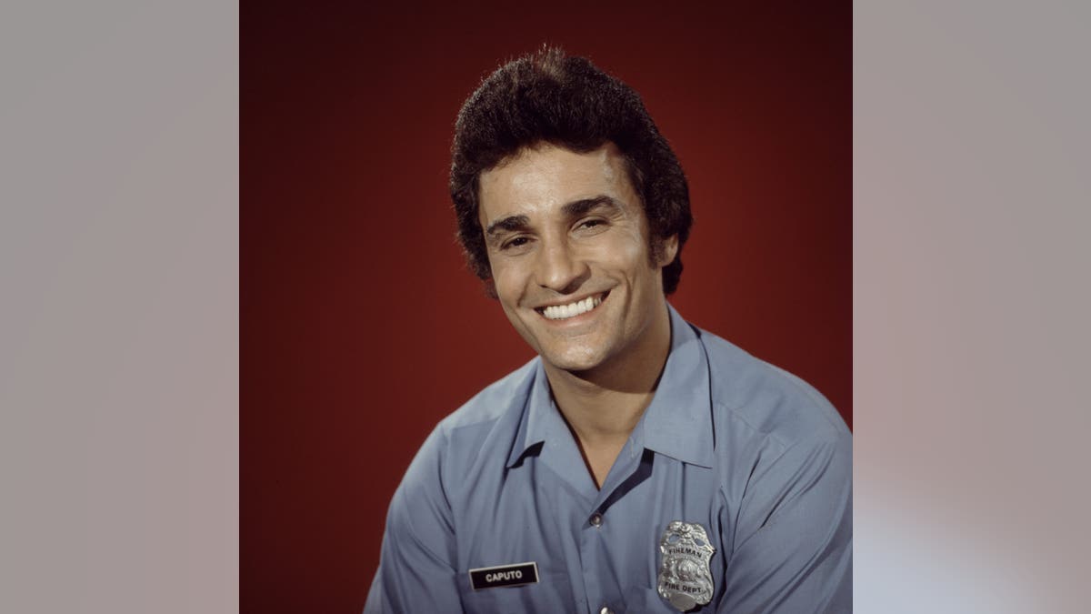 Michael DeLano posing for a portrait for "Firehouse"