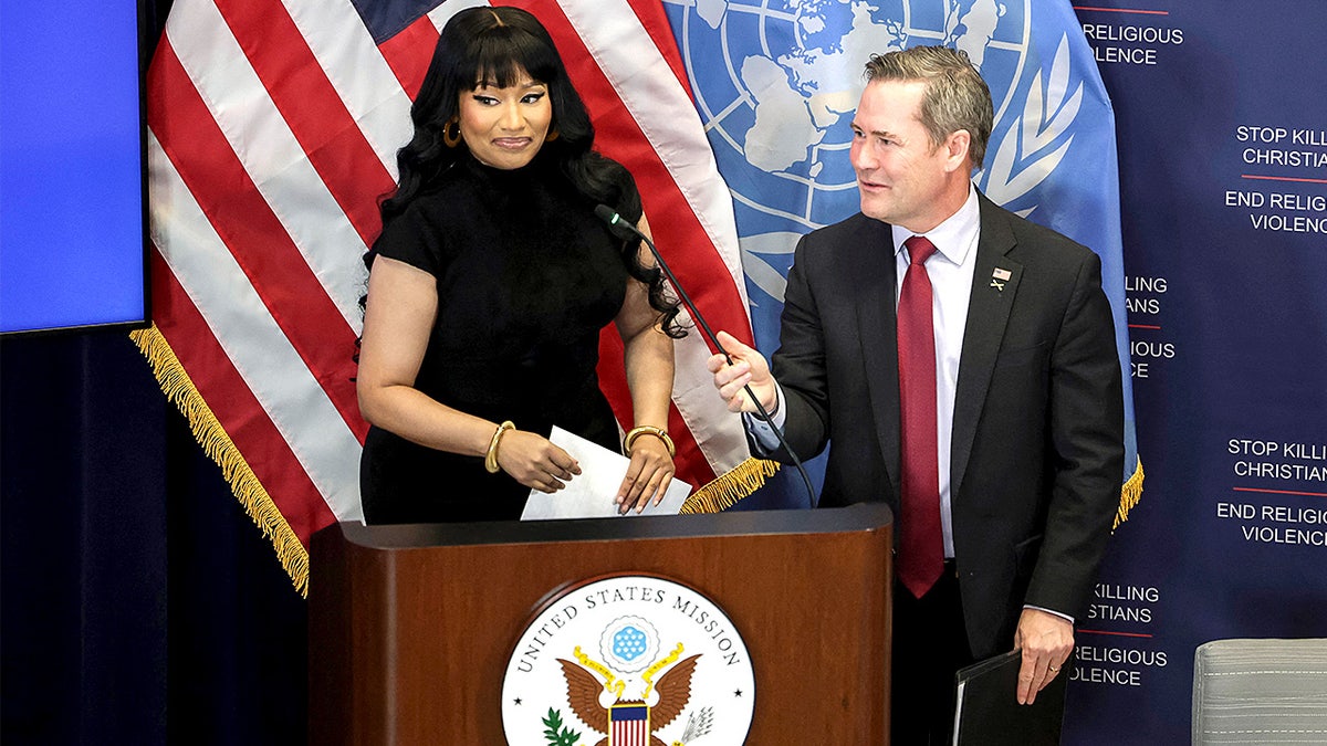 Rapper Nicki Minaj greets U.S. Ambassador to the U.N. Mike Waltz before a panel discussion at the U.S. Mission to the United Nations.