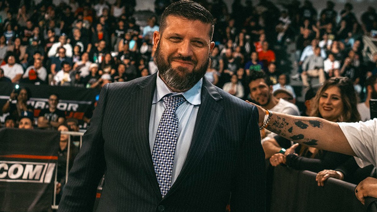 Court Bauer smiles at an event