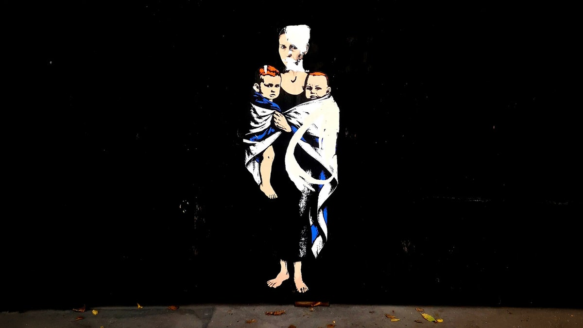 Mural of Shiri Bibas and two sons in Milan completely defaced