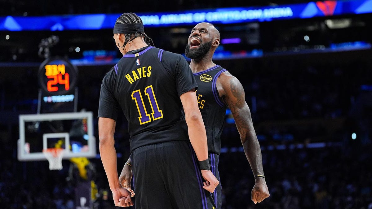 LeBron James and Jaxson Hayes chest bump