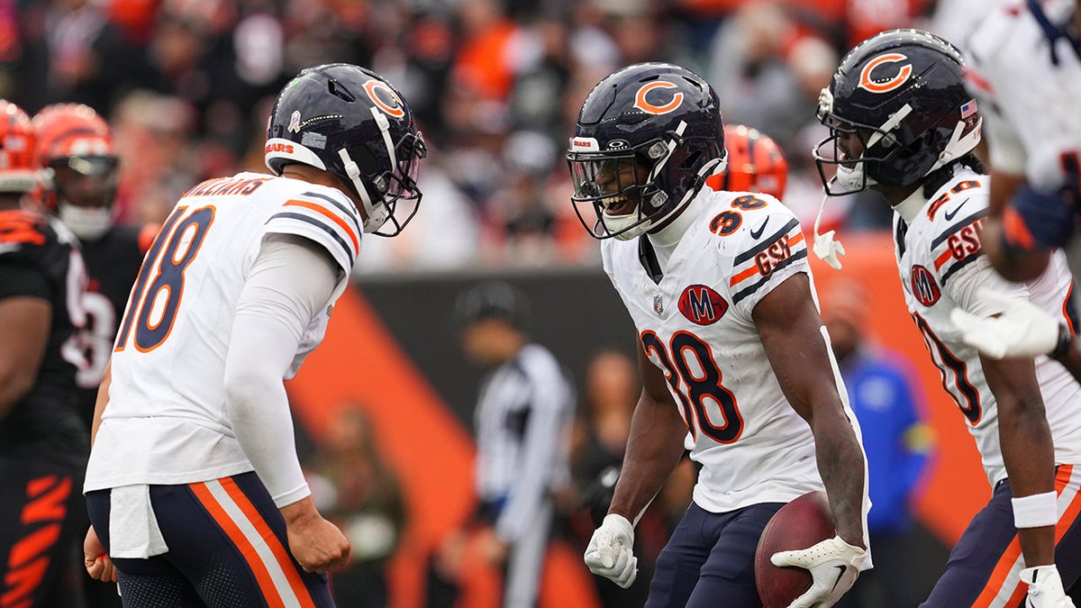 Caleb Williams and Brittain Brown celebrate