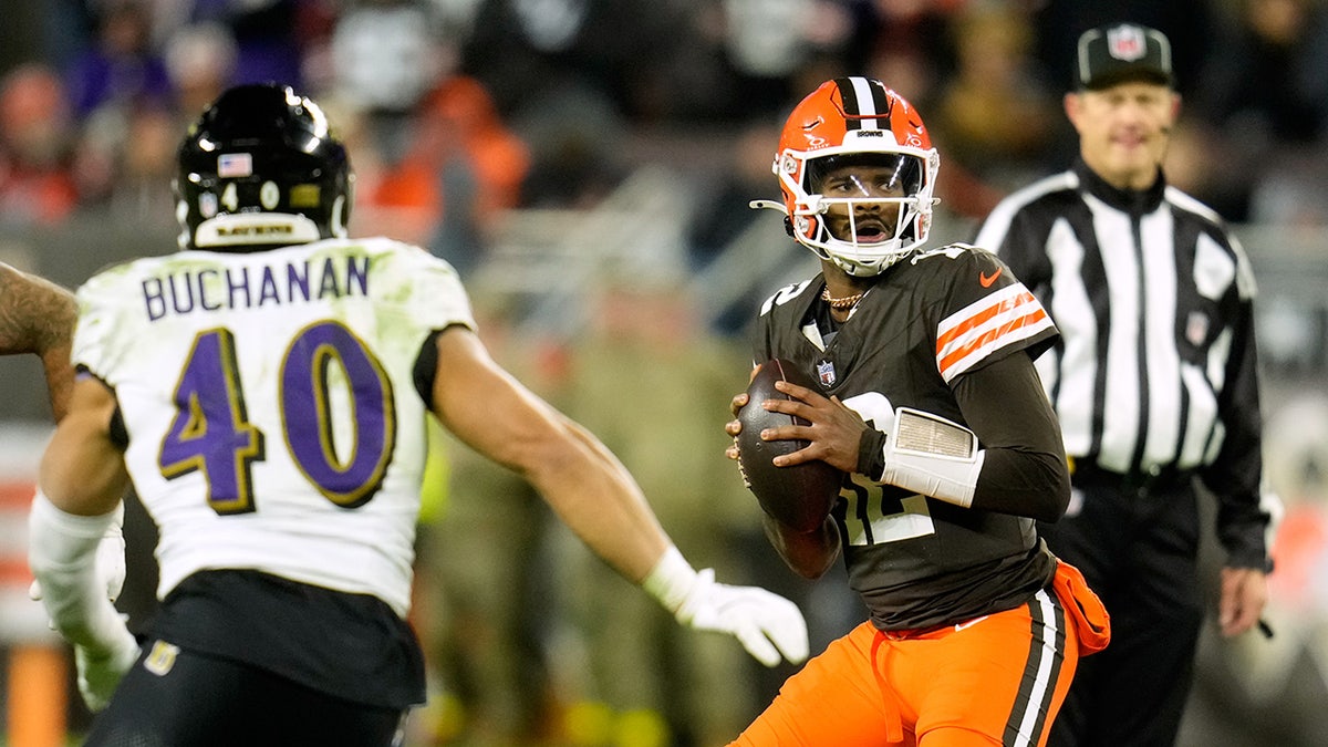 Shedeur Sanders looks down field