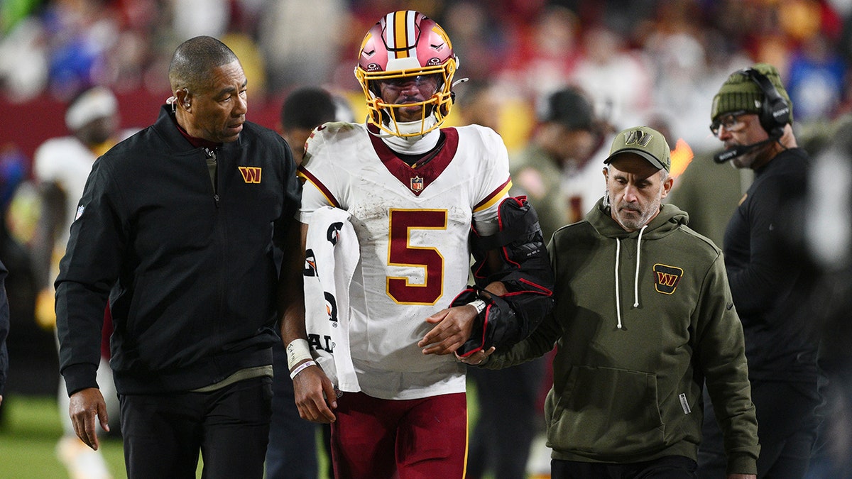 Jayden Daniels walks off the field