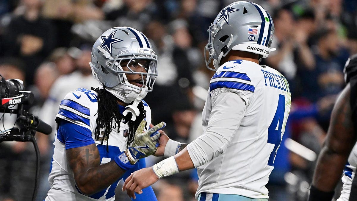 CeeDee Lamb celebrates with Dak Prescott