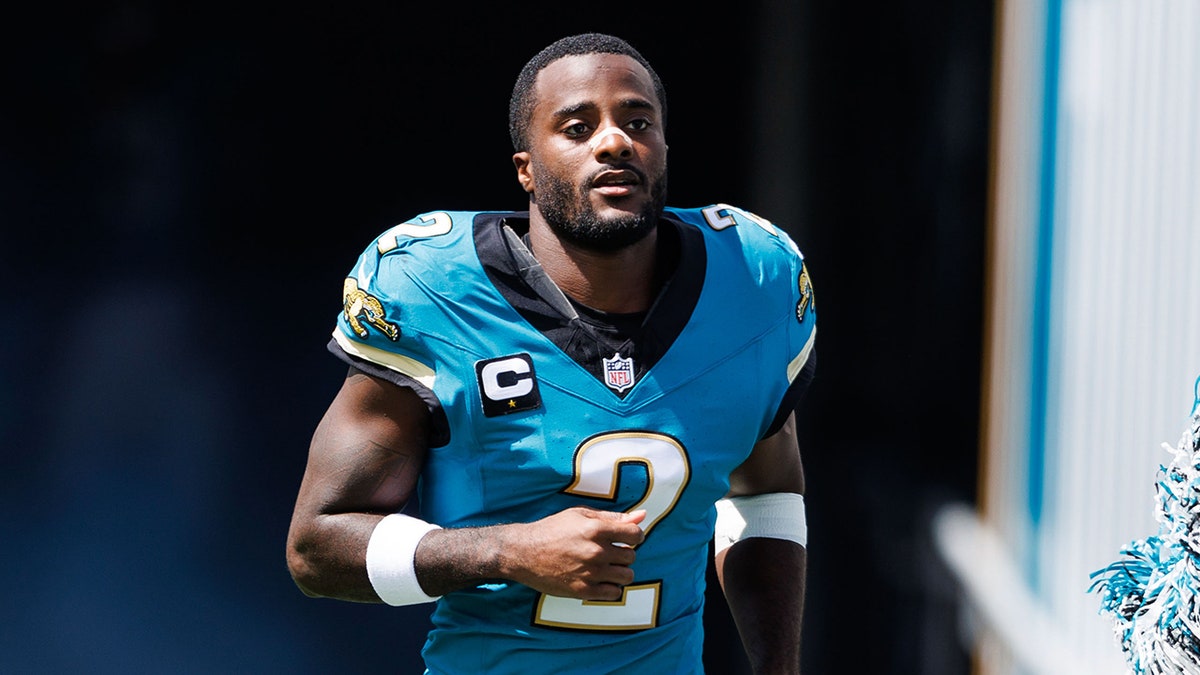 Jourdan Lewis runs onto the field