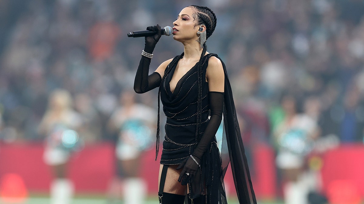 US national anthem singer for NFL's Spain game sparks debate over outfit choice at george magazine