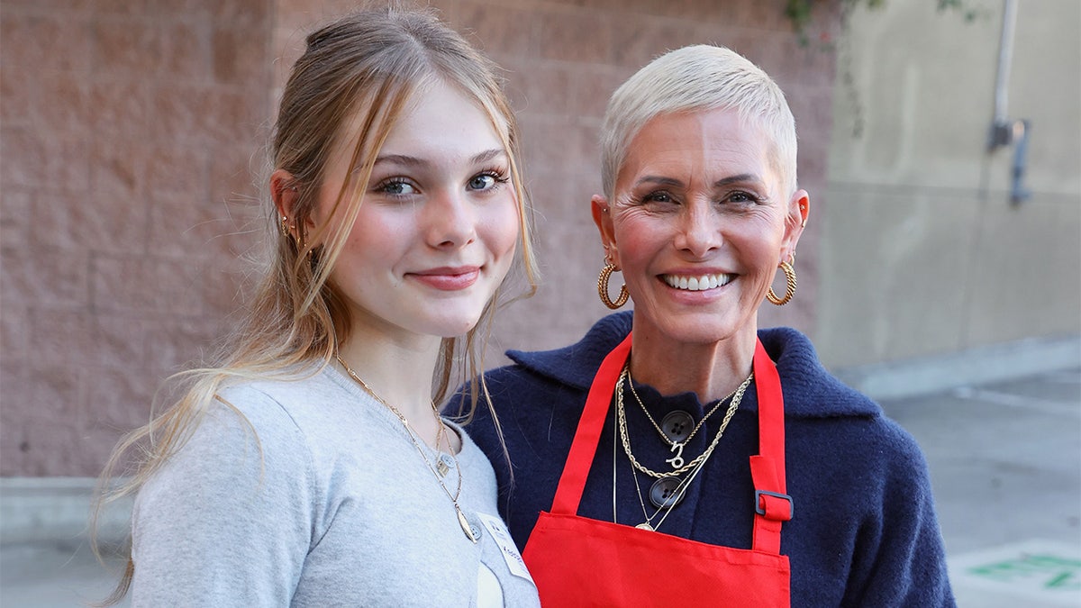 Dilyn and Nicole Eggert smiling together.
