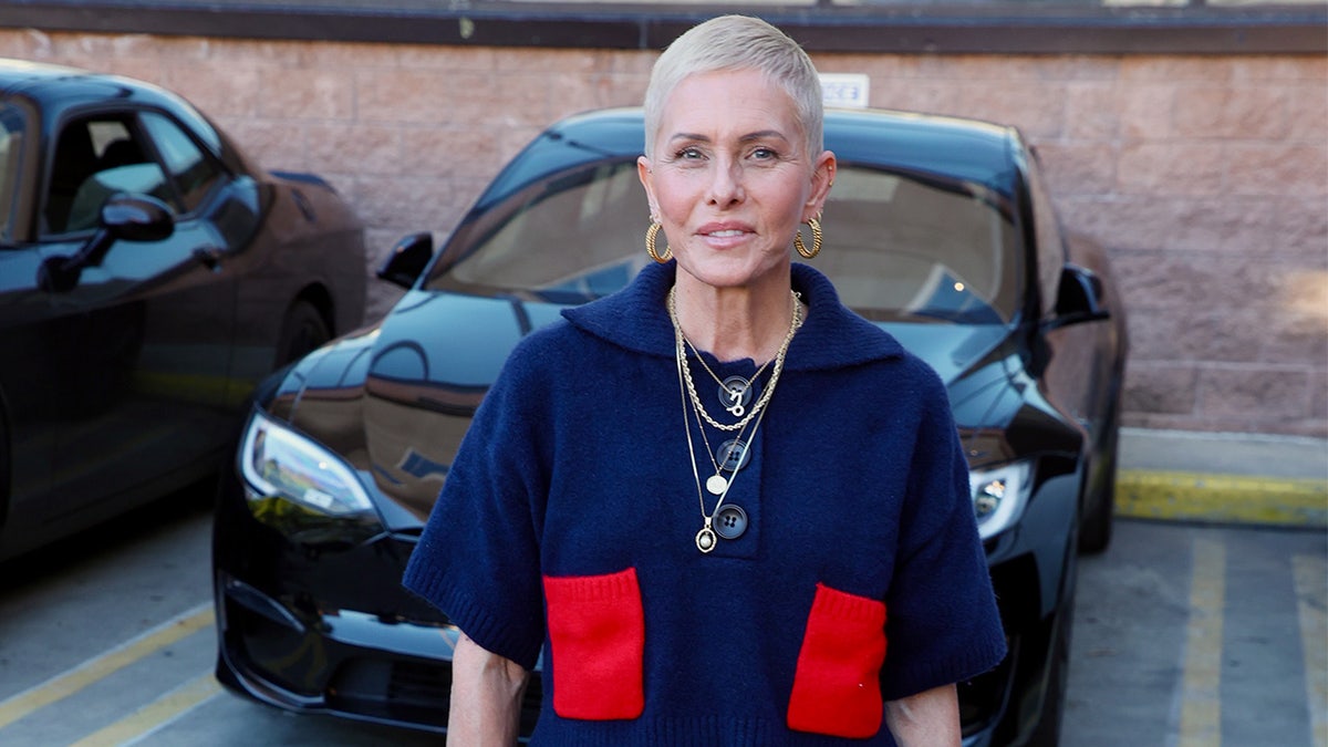 Nicole Eggert smiling.