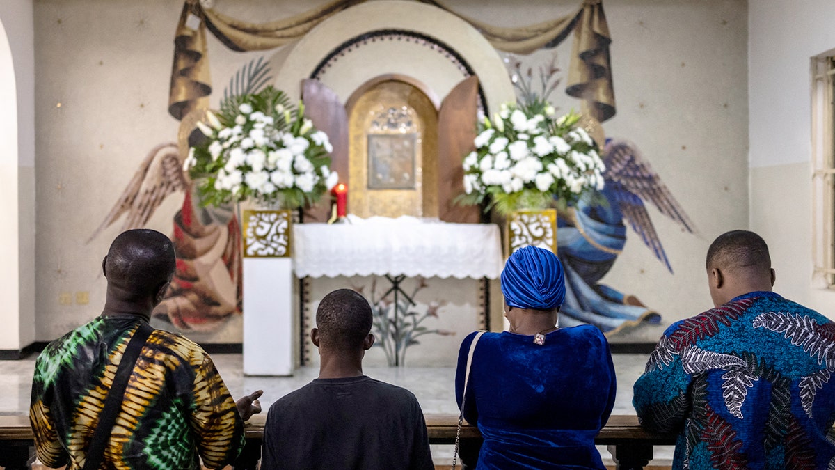 Worshippers attend a Catholic Mass inside the Church of the Assumption in Lagos, Nigeria.