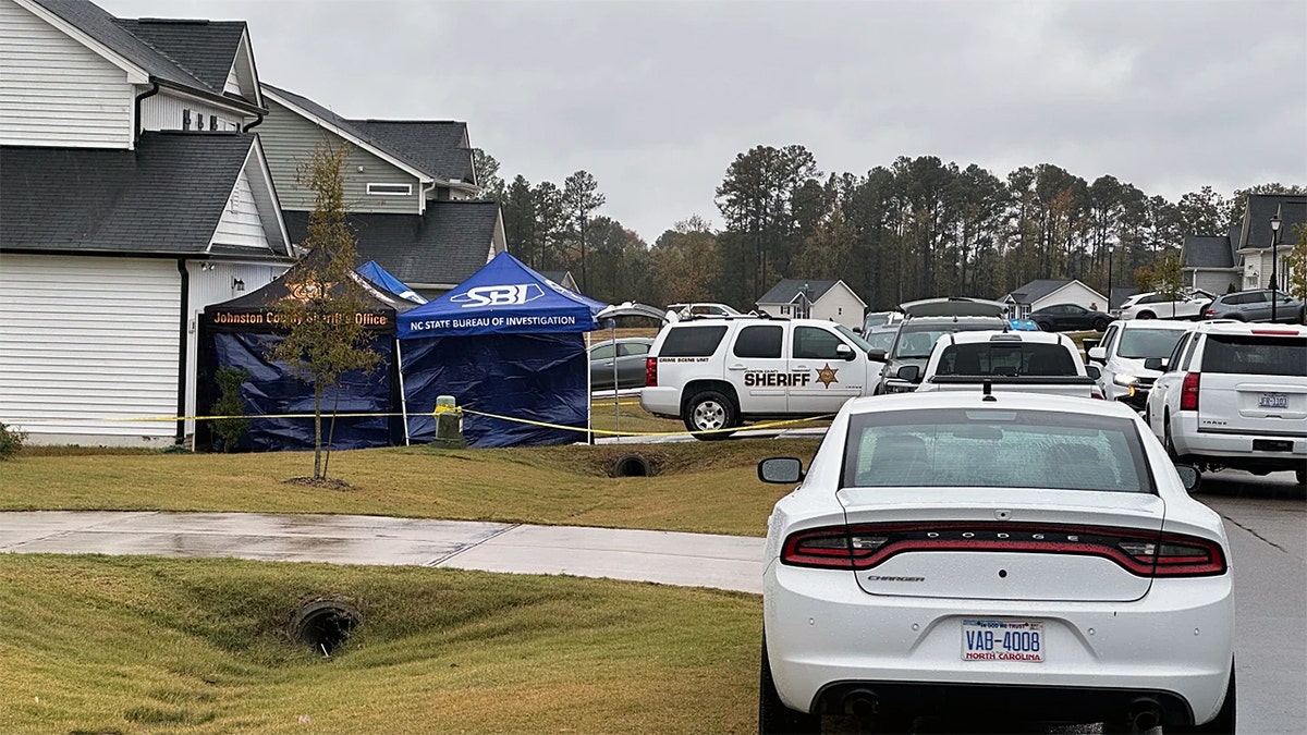 Law enforcement vehicles by Wellington Dickens III's home in North Carolina