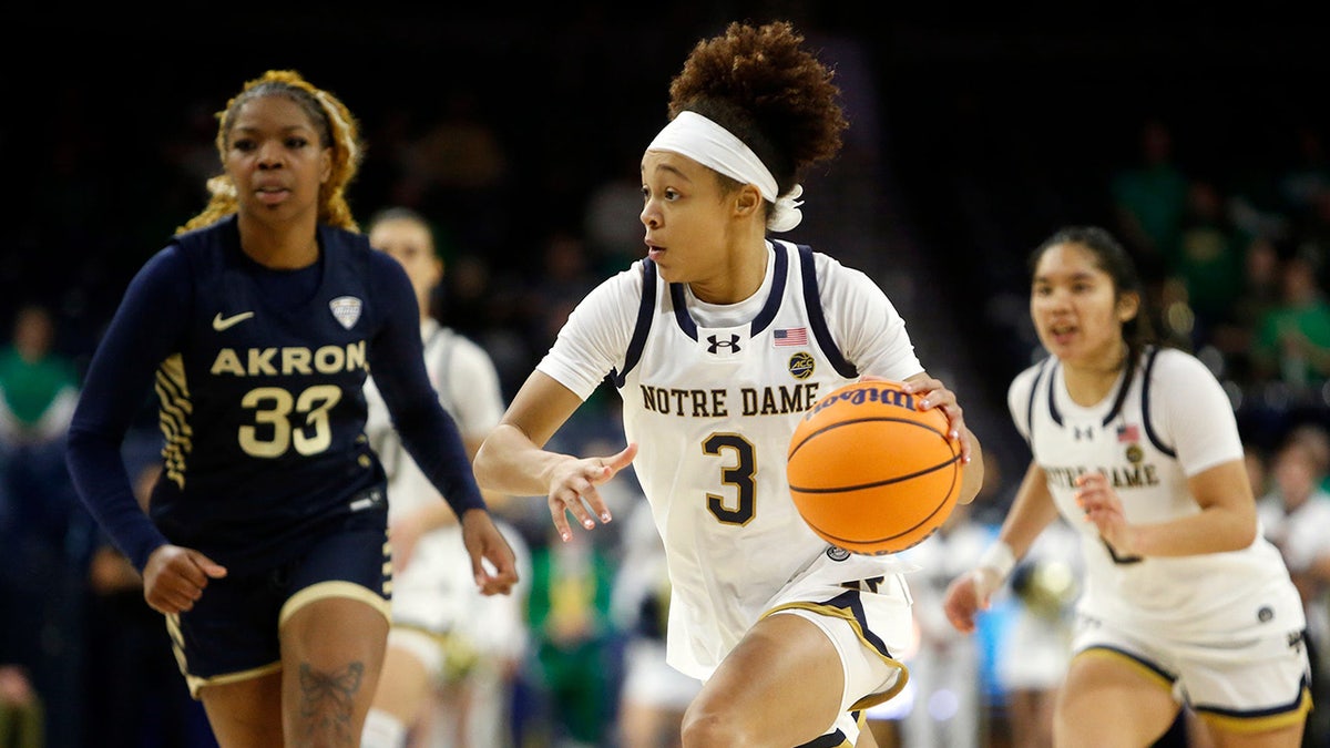 Hannah Hidalgo drives to the basket