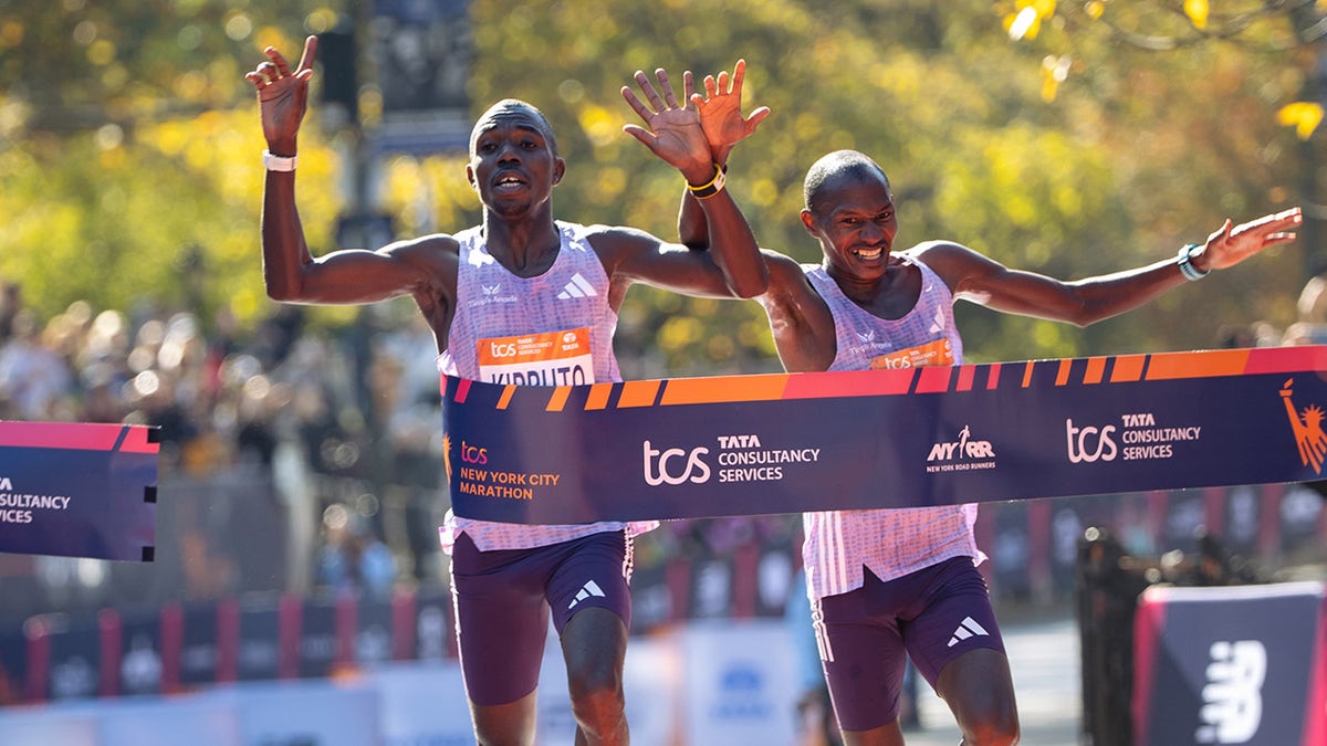 Benson Kipruto and Alexander Mutiso cross the finish line