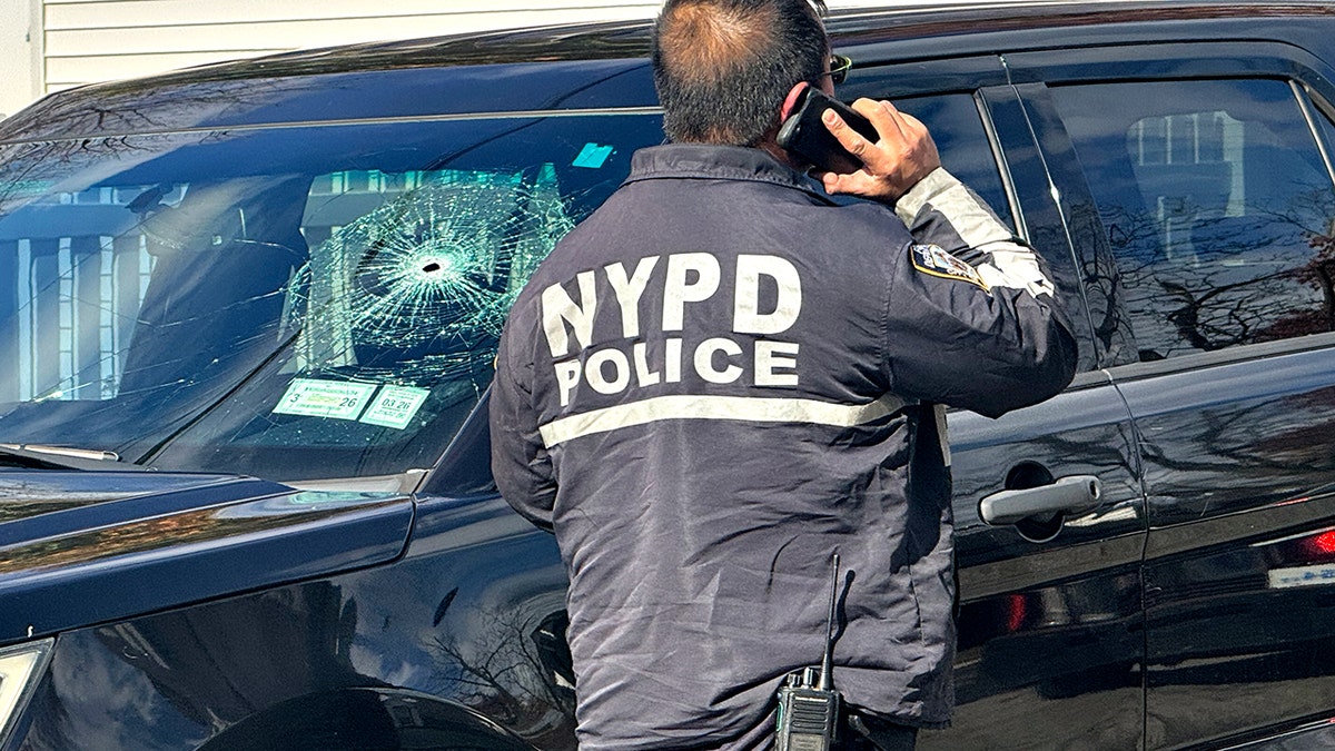 NYPD serviceman extracurricular unmarked car with spread successful windshield