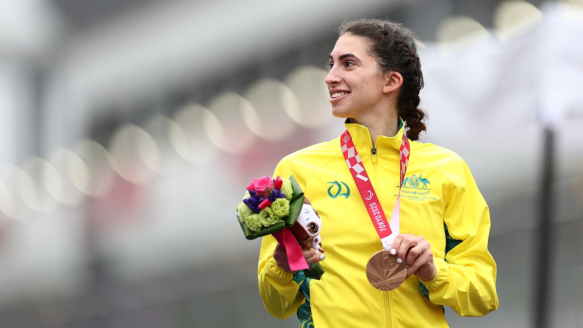 Paige Greco holds her bronze medal