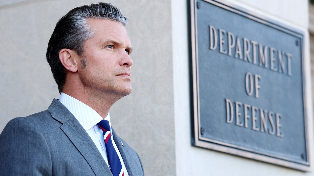 Pete Hegseth participates in a ceremonial honor cordon at the Pentagon.