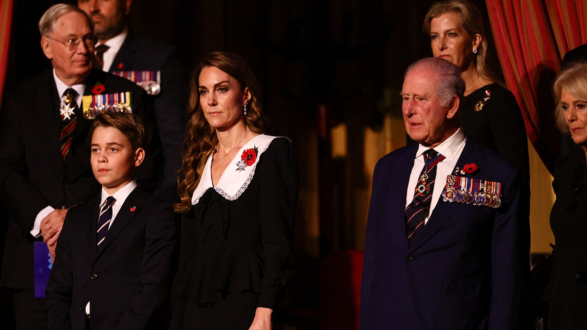 Prince George and Kate Middleton standing next to King Charles in dark attire during mass.