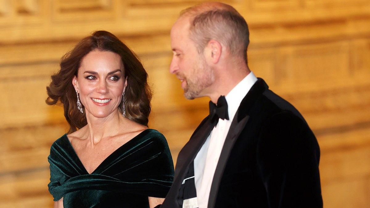 Kate Middleton smiling and looking lovingly at her husband Prince William.
