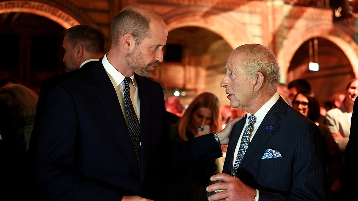 Prince William listened to King Charles speak during their evening engagement as they both wore matching black suits.