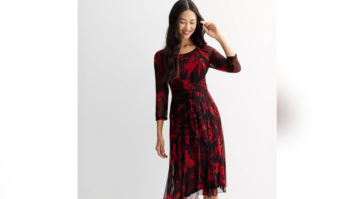 Look elegant without the effort in this printed mesh holiday dress.