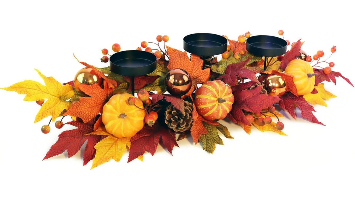 Pumpkins and maple leaves are an ideal Thanksgiving centerpiece.