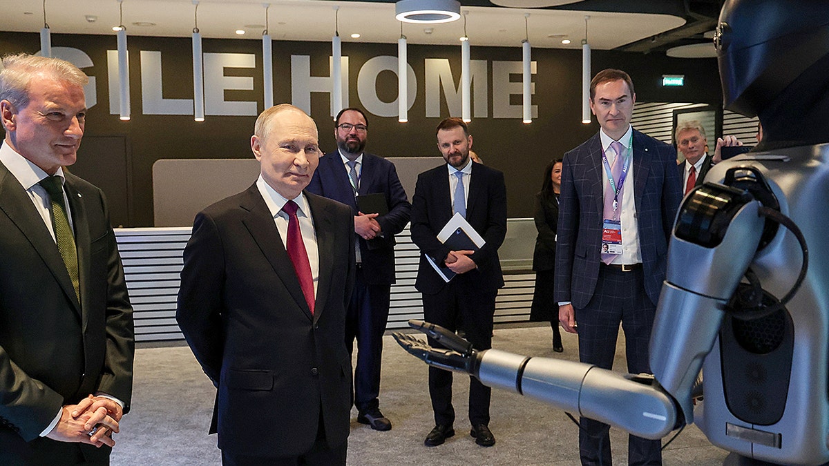 Putin watches the robot.